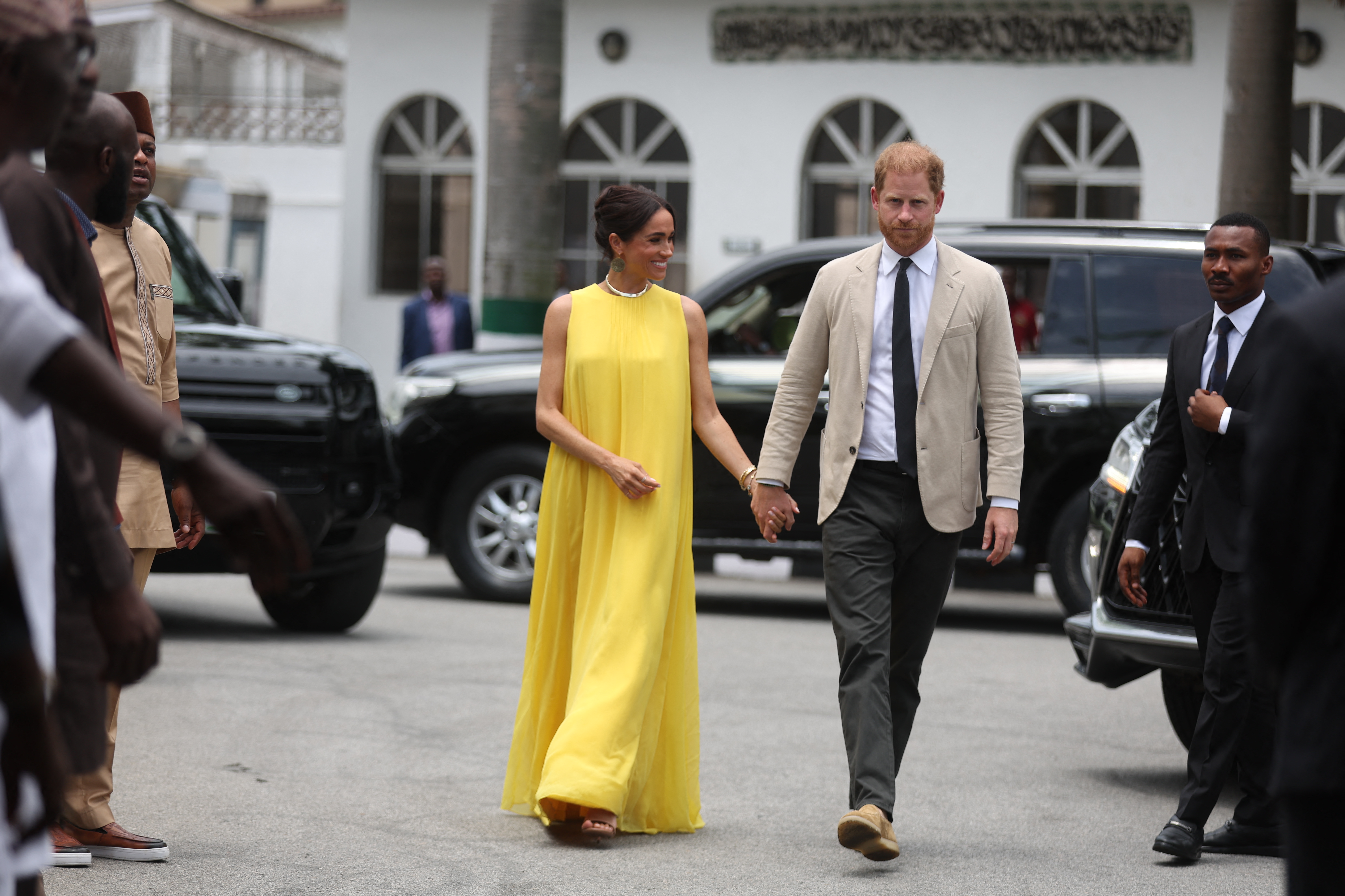 Meghan, Duchess of Sussex, and Britain's Prince Harry (R), Duke of Sussex arrive at the State Governor House in Lagos on May 12, 2024 as they visit Nigeria as part of celebrations of Invictus Games