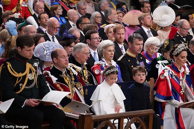 Prince Harry looks on at his brother Prince William in the front row during the coronation of their father King Charles III at Westminster Abbey