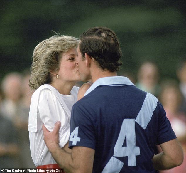 Royal kiss: Prince Charles held Diana close as they shared a kiss at the polo in Cirencester in 1985