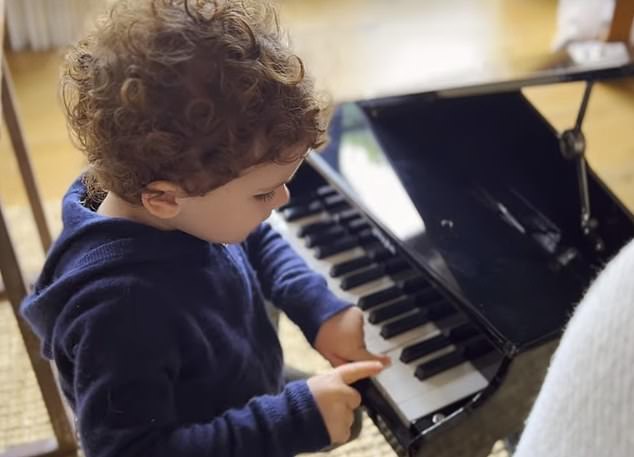 Netflix footage shows Archie tinkling away on a tiny piano while another clip shows him chasing seagulls around the beach