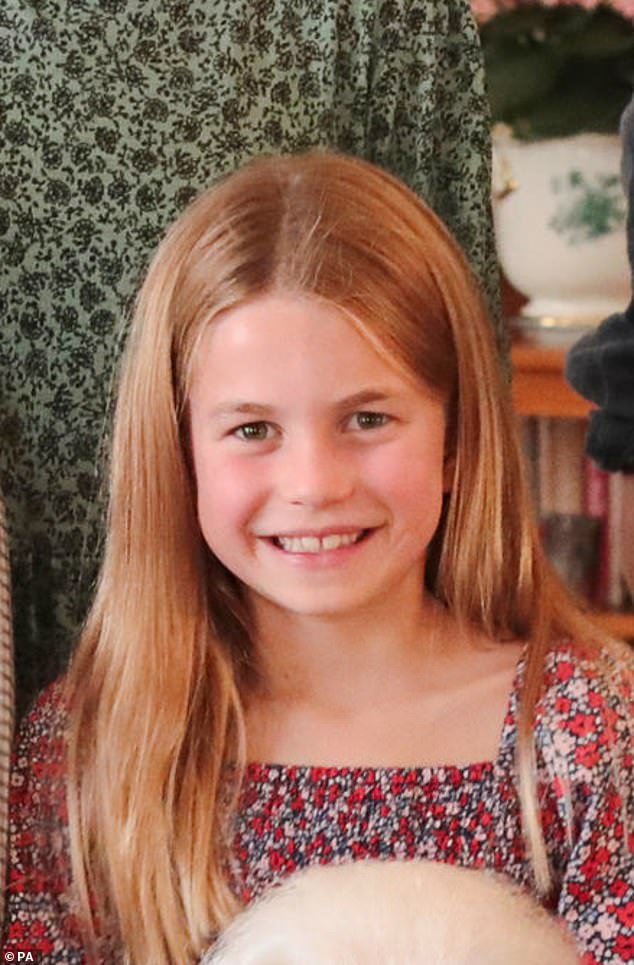 George's sister Princess Charlotte, who turns eight on May 2, took centre stage in today's picture, standing behind the Queen in a floral top