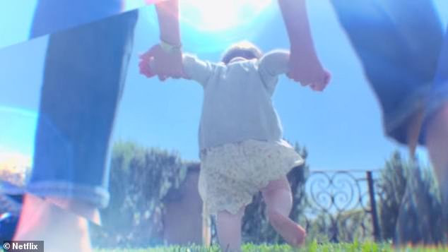 In another shot, the toddler can be seen running along as the couple walk around the grounds of their $14million mansion in California