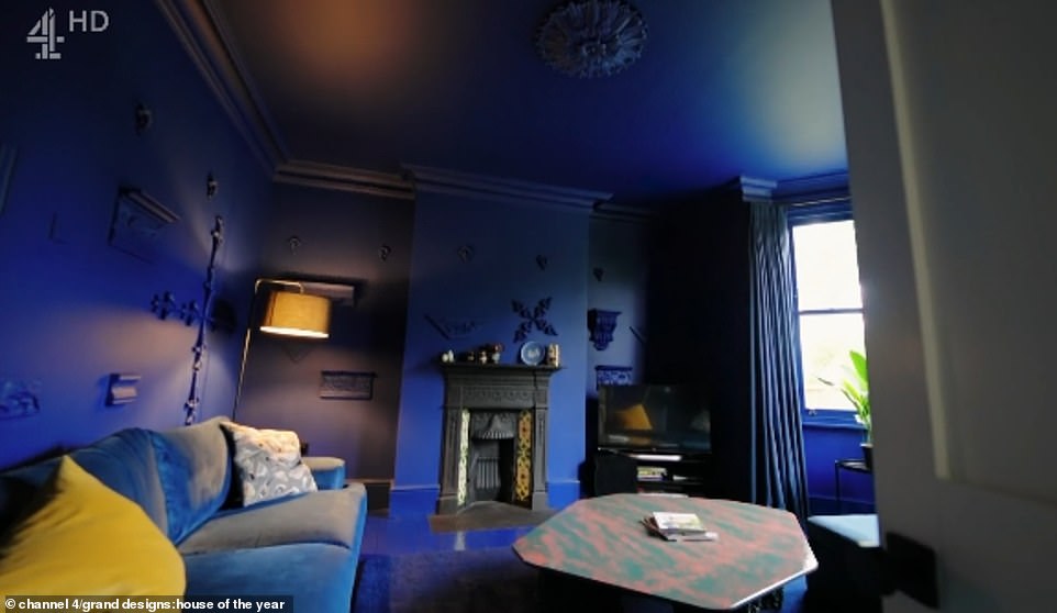 Meanwhile the living room at the front of the property had been painted in a deep blue tone, which spread from the ceiling down to the carpeted floor