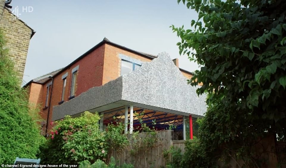 The large metal mountain which was built onto the back of the extension was visible from the next door neighbour's garden (pictured)