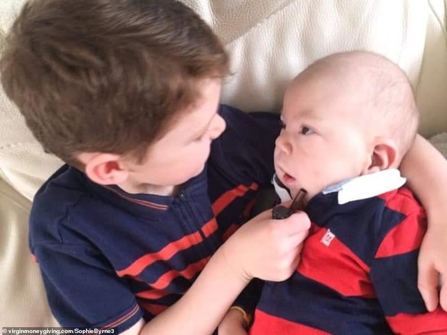 Harry Byrne (left) took on a 45-mile hiking challenge to raise money for the hospice that looks after his seriously ill baby brother Reuben (right)