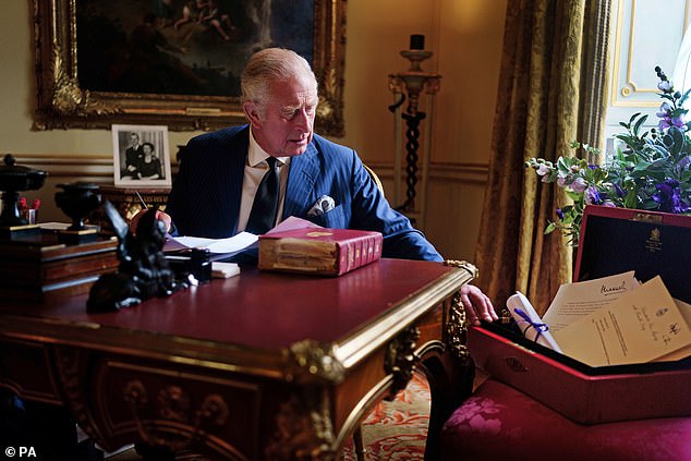 King Charles (pictured here carrying out official government duties from his red box at Buckingham Palace on September 23) reportedly wants to know he can 'trust' the Sussexes