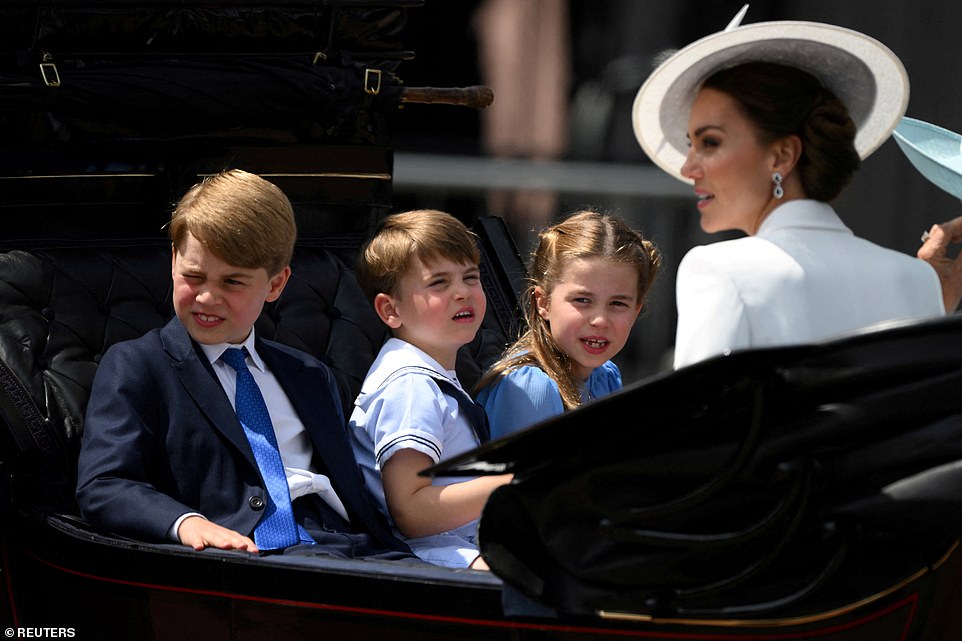 She repeated the gesture while watching a presentation ceremony at the King's Cup regatta on the Isle of Wight in 2019. At the christening of younger brother Prince Louis, she was heard telling off photographers and declaring they were not allowed inside. Meanwhile, she took part in her first royal engagement in June 2022, when she joined big brother George and her parents in Cardiff. Clips from several events during the Jubilee, including Sunday's Platinum Pageant and Buckingham Palace balcony appearance, as well as Thursday's carriage ride (pictured), show Charlotte, giving her younger brother Prince Louis a dressing down.