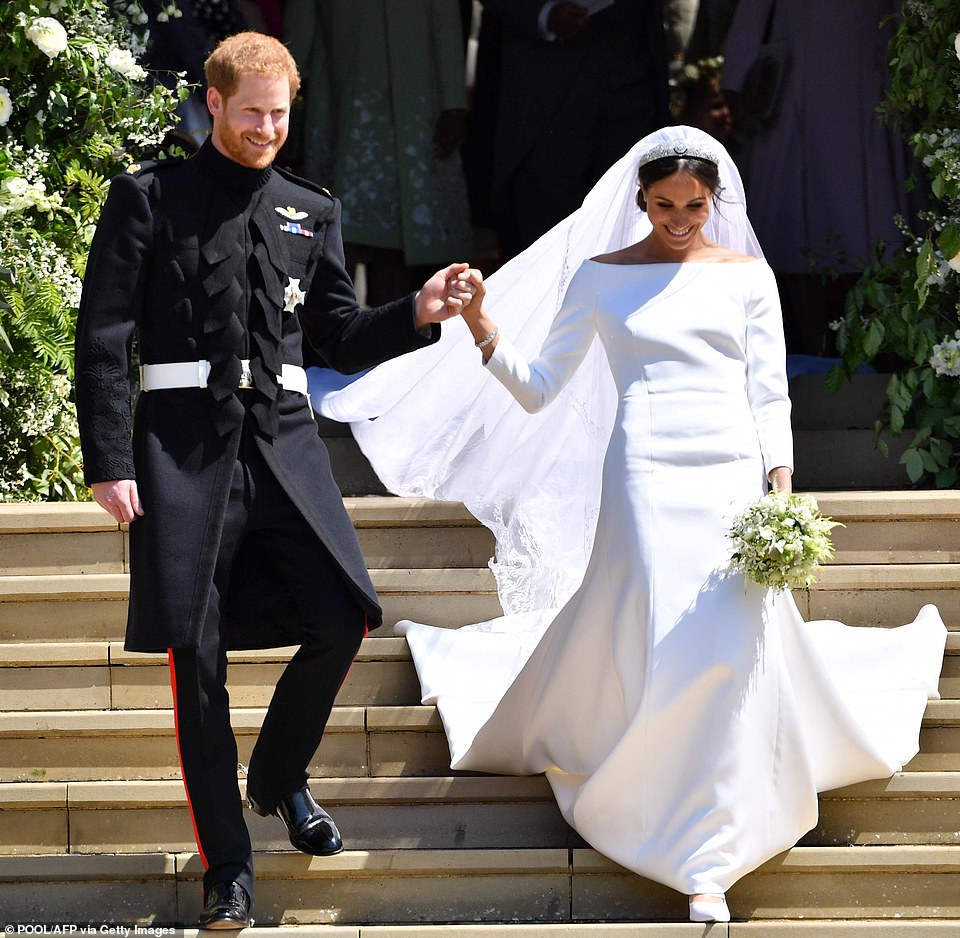 Prince Harry and Meghan Markle emerge from St George's Chapel at Windsor Castle on May 19, 2018 after their wedding