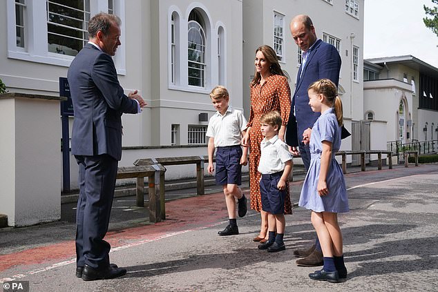 Prince George, Princess Charlotte and Prince Louis, accompanied by their parents the Duke and Duchess of Cambridge, are greeted by Headmaster Jonathan Perry as they arrive for a settling in afternoon at Lambrook School, near Ascot in Berkshire