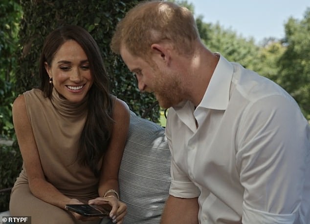 Meghan donned a $189 camel sleeveless top and matching $162 skirt from Malibu brand Bleusalt, which she paired with minimalist earrings