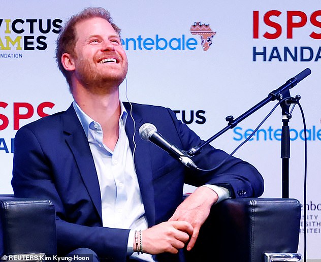 Prince Harry laughs today at the ISPS Sports Values Summit 'Special Edition' in Tokyo, Japan