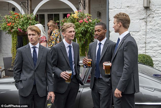 Wesley, centre right, pictured at the wedding of his adoptive parents, India Hicks and David Flint-Wood