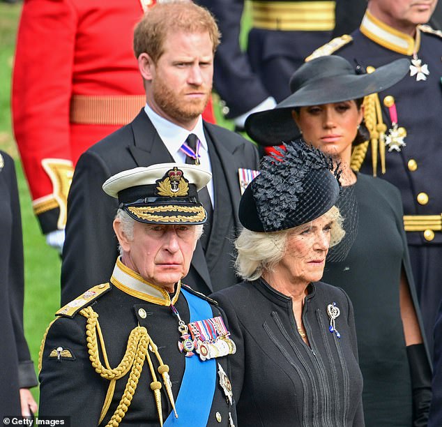 Harry and Meghan walking behind Charles and Camilla as Queen Elizabeth II's coffin was transferred from the gun carriage to the hearse at Wellington Arch on September 19, 2022