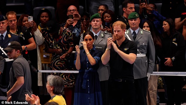 Video footage captures the moment Meghan was moved to tears during the medal ceremony