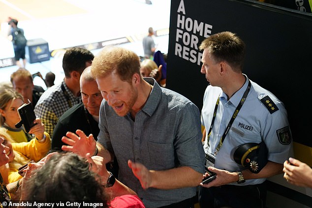 Prince Harry speaks to the crowd at the Invictus Games in Dusseldorf, Germany on Thursday