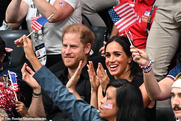 The Duke and Duchess of Sussex cheer on the US team as they watch the basketball at the Invictus Games yesterday