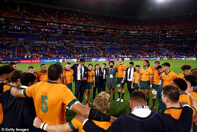 The devastated Wallabies formed a huddle (above) after their humiliating World Cup annihilation at the hands of Wales on Sunday, but head coach Jones was nowhere to be seen