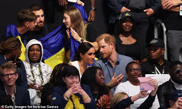 Harry and Meghan looked very loved up as they enjoyed chatting with each other during today's event