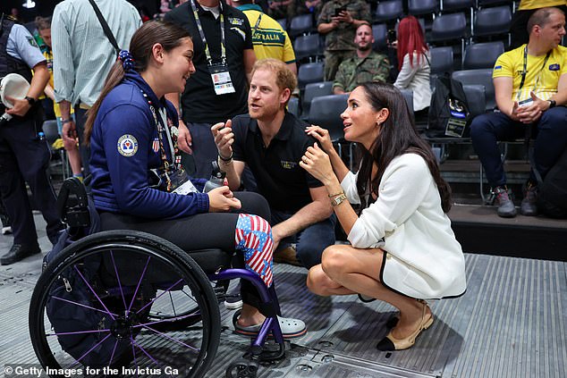 Prince Harry and Meghan Markle talk with Annika Hutsler of the USA at the games today