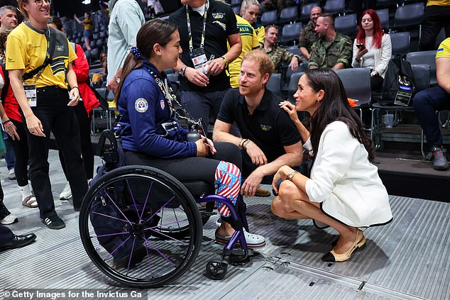 Prince Harry and Meghan Markle talk with Annika Hutsler of the USA at the games today