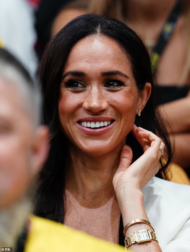 The Duchess of Sussex smiles during the Invictus Games at the Merkur Spiel-Arena today