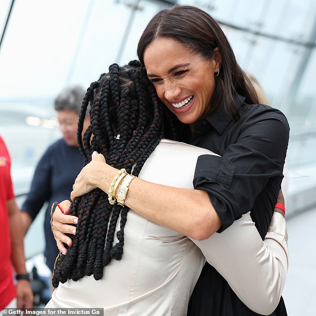 She smiled as she hugged the competitor and told her 'You're my Nigerian sister!'