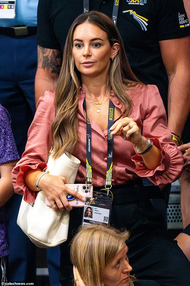 Beth Herlihy, the Duke and Duchess of Sussexes' aide, sat side by side with Harry