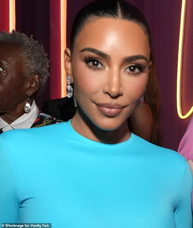 Here, Kim turns out in a blue round-neck with pulled-back hair for the 2022 Vanity Fair Oscars party