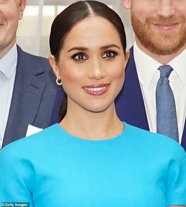 This time Meghan gets there first - appearing at the Mansion House in 2020 with a round-neck blue dress from Victoria Beckham and hair pulled back into a ponytail