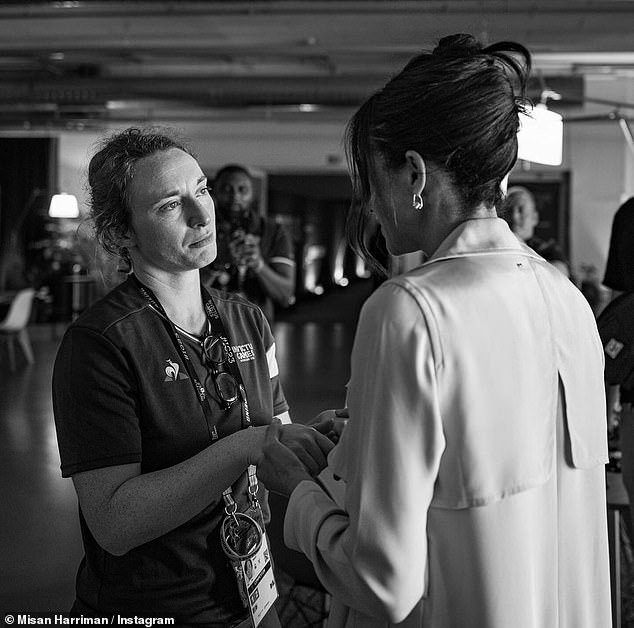 A final image shared by Mr Harriman, who is based in London, showed the Duchess, sporting a chic up-do hairstyle, holding the hands of a competitor