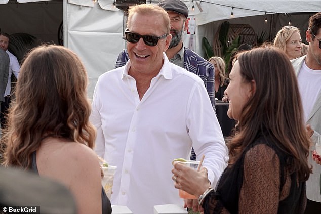 Cheerful: The Yellowstone star appeared to be in good spirits as he flashed a big smile at the event that drew celebrities as well as local police and firefighters