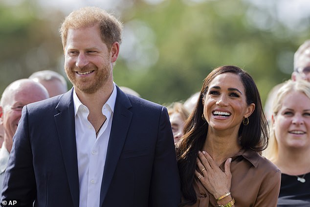 The mother-of-two, 42, opted for a monochrome ensemble with two-tones of brown, while wearing $1,490 wide-leg silk trousers from Gabriel Hearst, which she previously sported to the One Young World roundtable in 2022