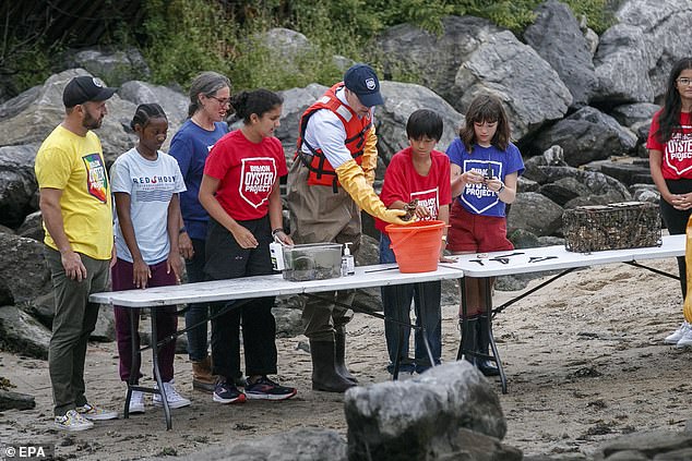 Prince of Wales interacts with others from the Billion Oyster Project to learn more about their work to revitalize New York's waterways