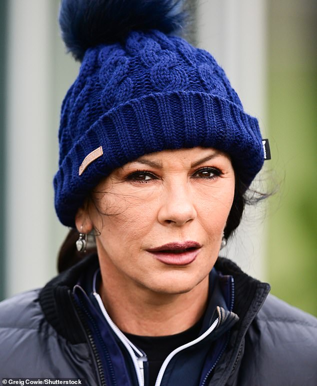 The 54-year-old actress, who is married to Fatal Attraction star Michael Douglas, 79, wore a bobble hat and padded jacket over several layers