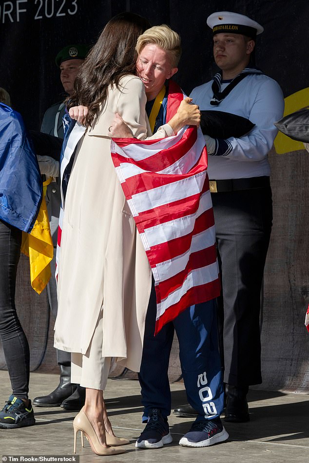 The Duchess of Sussex, 42, handed the gold medal to Danielle Pothoof at the Swimming Medals Ceremony during day seven of the sporting event in Dusseldorf