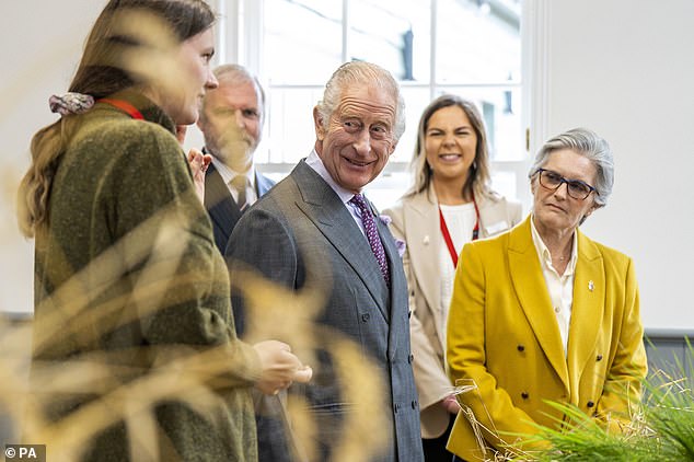 The monarch, 74, opted for a classic grey suit and colourful tie as he head to the MacRobert Farming and Rural Skills Centre, on the Dumfries House estate in East Ayrshire