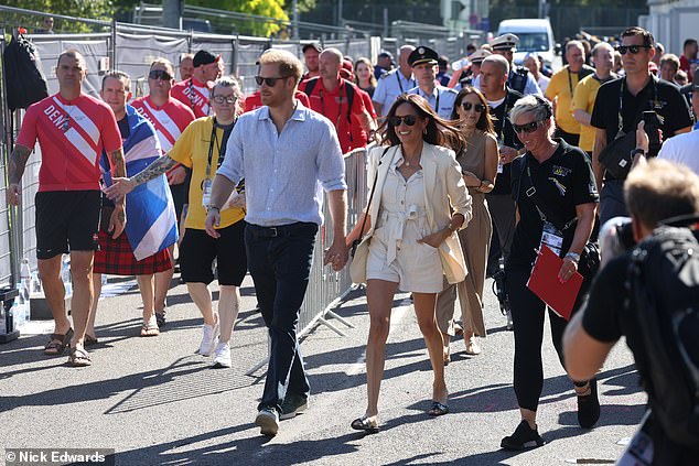 The Duke and Duchess of Sussex walk through the Invictus Games area in Dusseldorf today