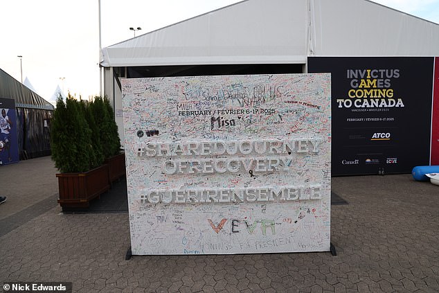 The wall appears to be packed with colourful signatures, well-wishes and notes of encouragement from those attending and participating in the competition