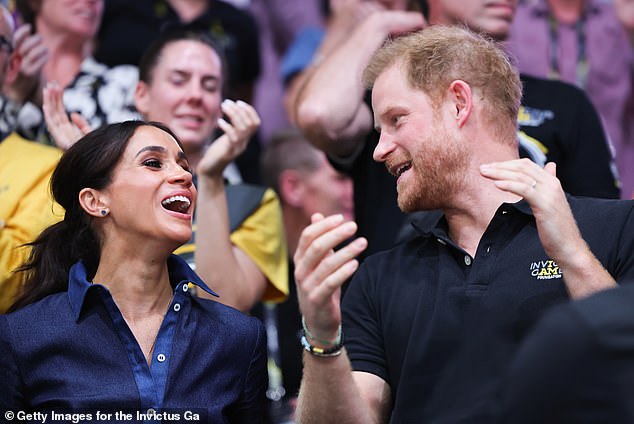 Both Meghan and Harry appear elated whilst watching the volleyball final in Dusseldorf