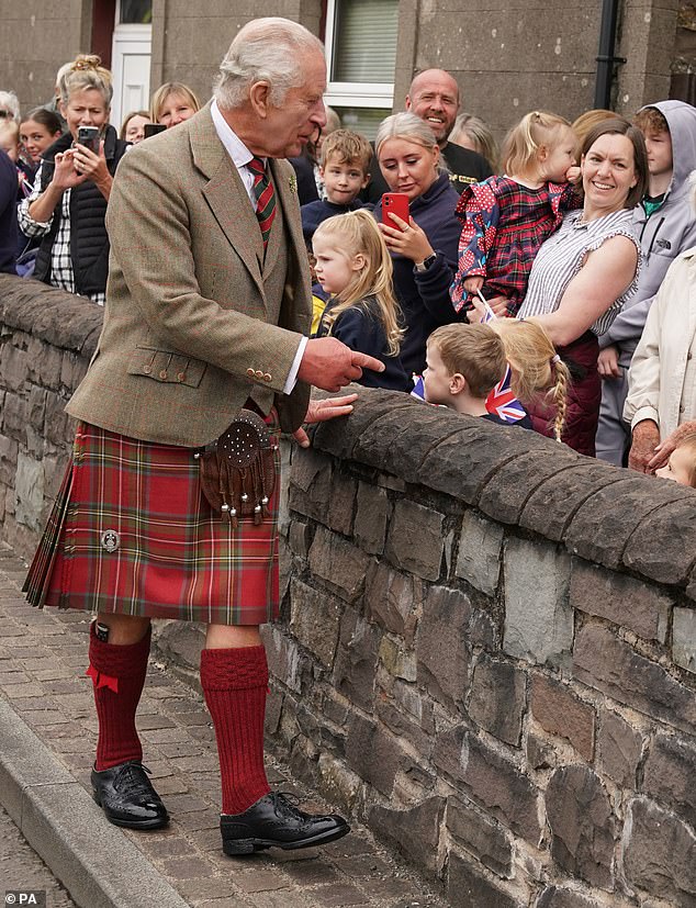 Among those he spoke to were young schoolchidren, who were waving Union flags during the walkabout