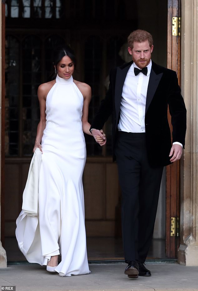 The shape is reminiscent of the Duchess' second wedding dress, which featured a similar neckline. The evening halter-neck dress was made from silk crepe and the halter neck gown was pure white. Here Meghan and Harry are pictured leaving Windsor Castle after their wedding to attend an evening reception at Frogmore House