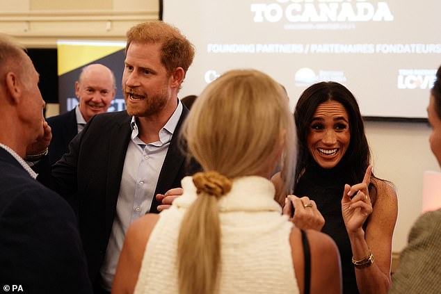 The father-of-two, 39, looked dapper in a smart black suit, which he paired with a crisp blue shirt