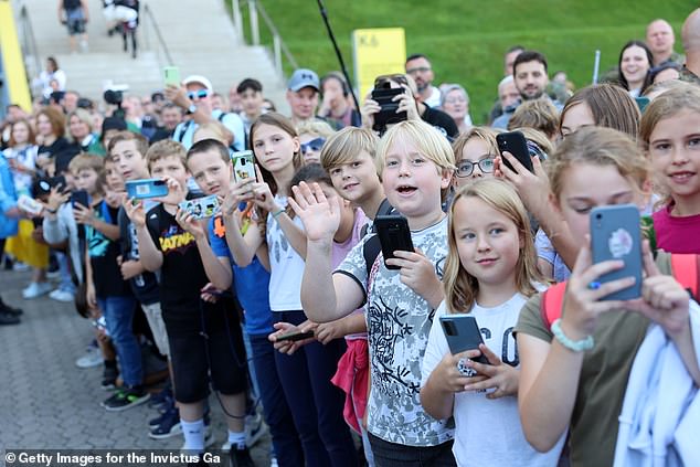 Hoards of children gathered at the space in order to catch a glimpse of the royal couple earlier this afternoon