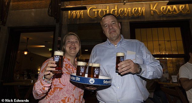 Harry and his party took up two tables and were served their food and beer by head waiter Frank Wackers (pictured with owner of the restaurant Thea Ungermann), who has worked at the restaurant for 38 years