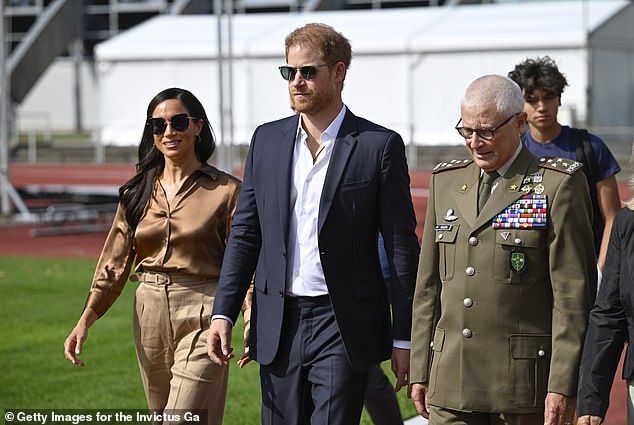 Meghan wowed in the all brown ensemble as she headed out