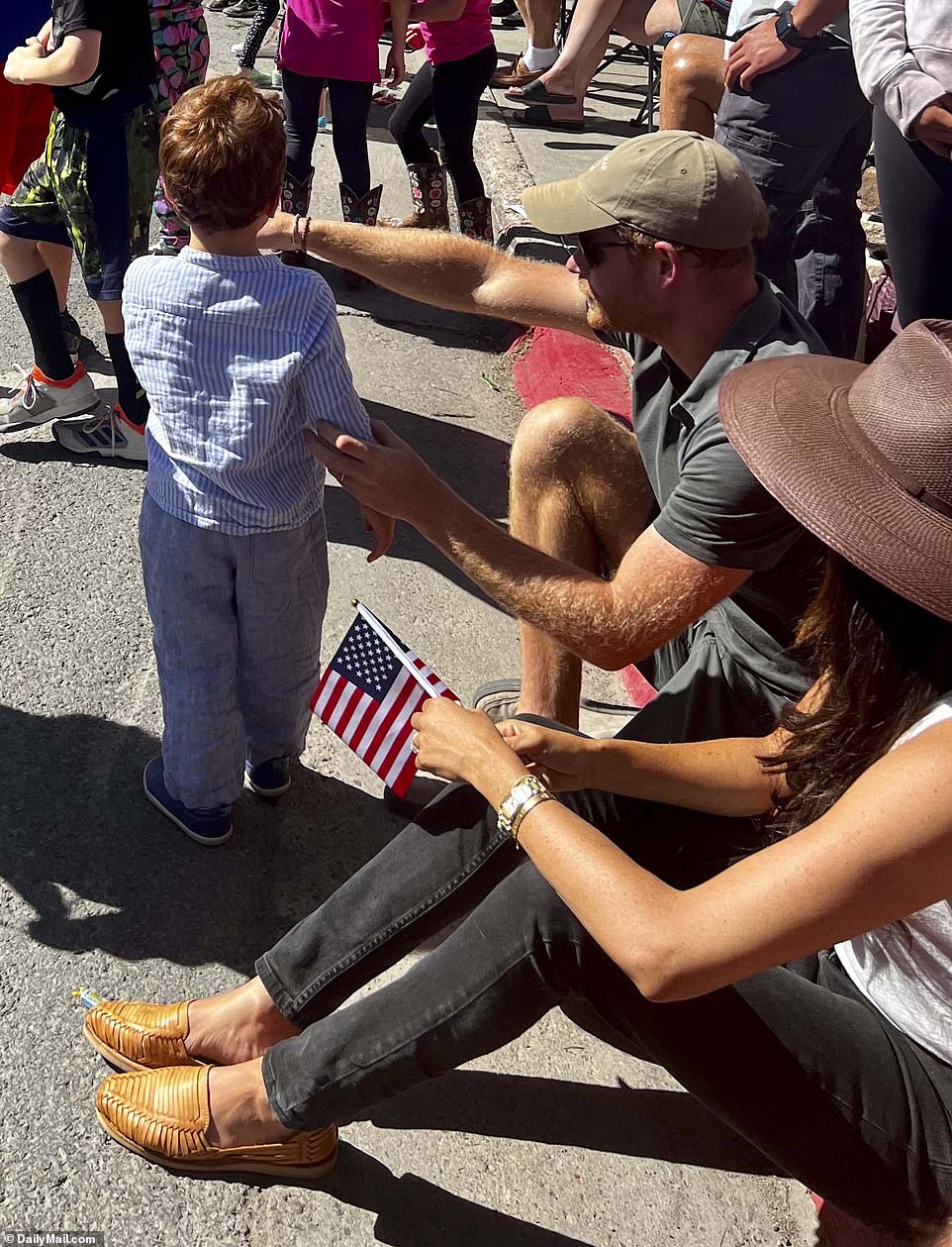 'They didn't stay too long as I think Meghan wanted to get Archie out of the sun,' Deborah added. 'It was an opportune exit as just after they left people started spraying the crowd with water jets. 'An older lady had asked Harry if she could sit in one of their chairs and he said yes, of course, being a perfect gentleman.