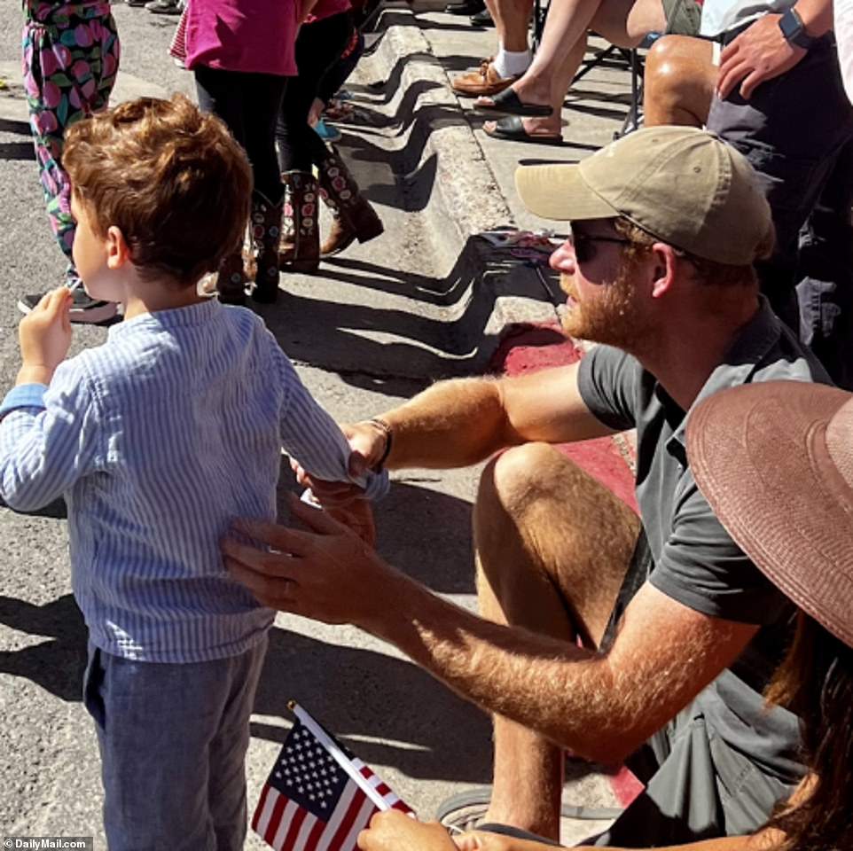 According to onlookers, the group went completely unnoticed until 15 minutes into the two-hour parade billed locally as a 'patriotic celebration of culture and community'