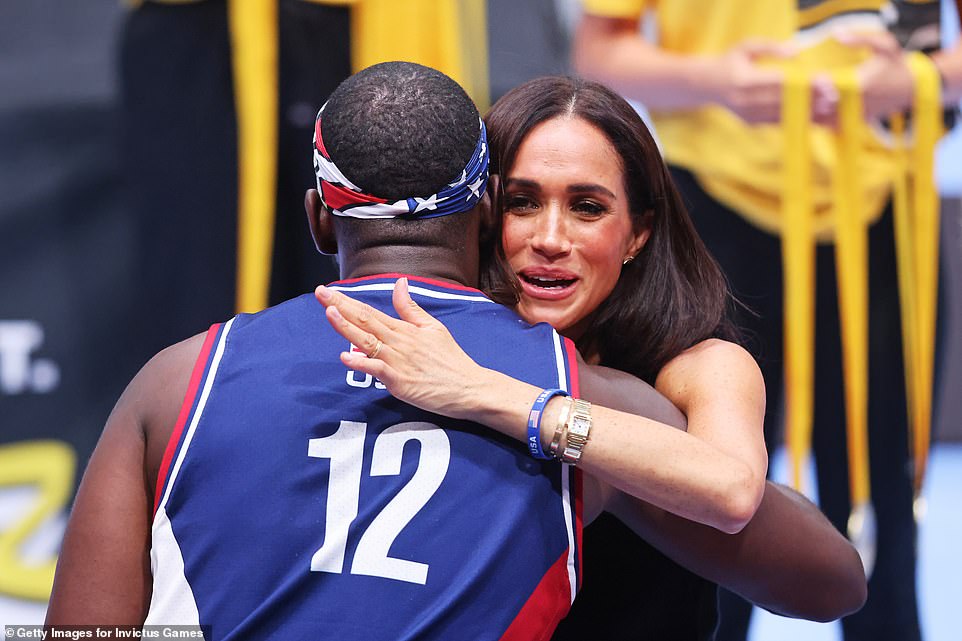 Meghan Markle chose a casual outfit for her trip to the Invictus Games. She wore Ulla Johnson sailor-style Polina wide-legged trousers and a navy V-neck jumper. Her choice of footwear was a pair of ivory calfskin Valentino 'Roman Stud' mules, valued at $770.