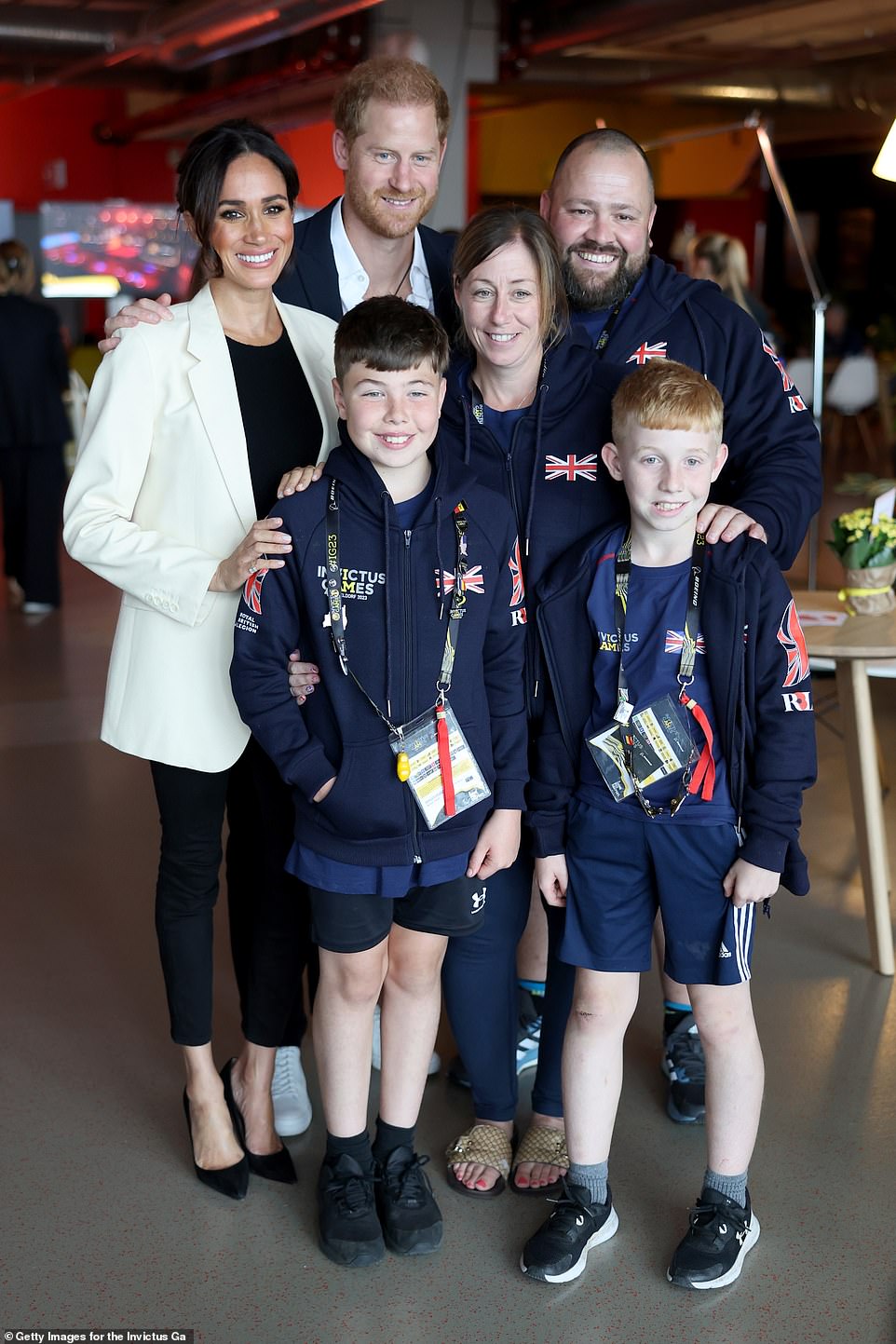 For her second appearance at the Invictus Games, Meghan Markle paired $98 J Crew linen shorts and a black tank top with a £177 J Crew blazer, Givenchy belt, and £910 Chanel shoes. She accessorized with £595 Kimaï hoop earrings.