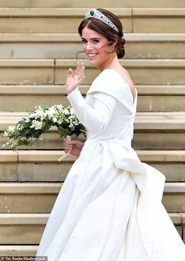 The bride wore a long-sleeved open-backed gown with folded shoulders and a voluminous train designed by London duo Peter Pilotto and Christopher De Vos